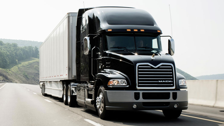 A black truck on the road Description automatically generated